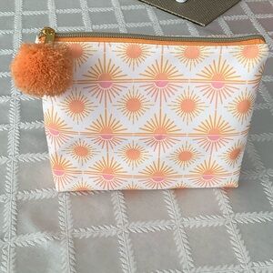 NWOT Vibrant Starburst Cosmetic Bag with Pom Pom